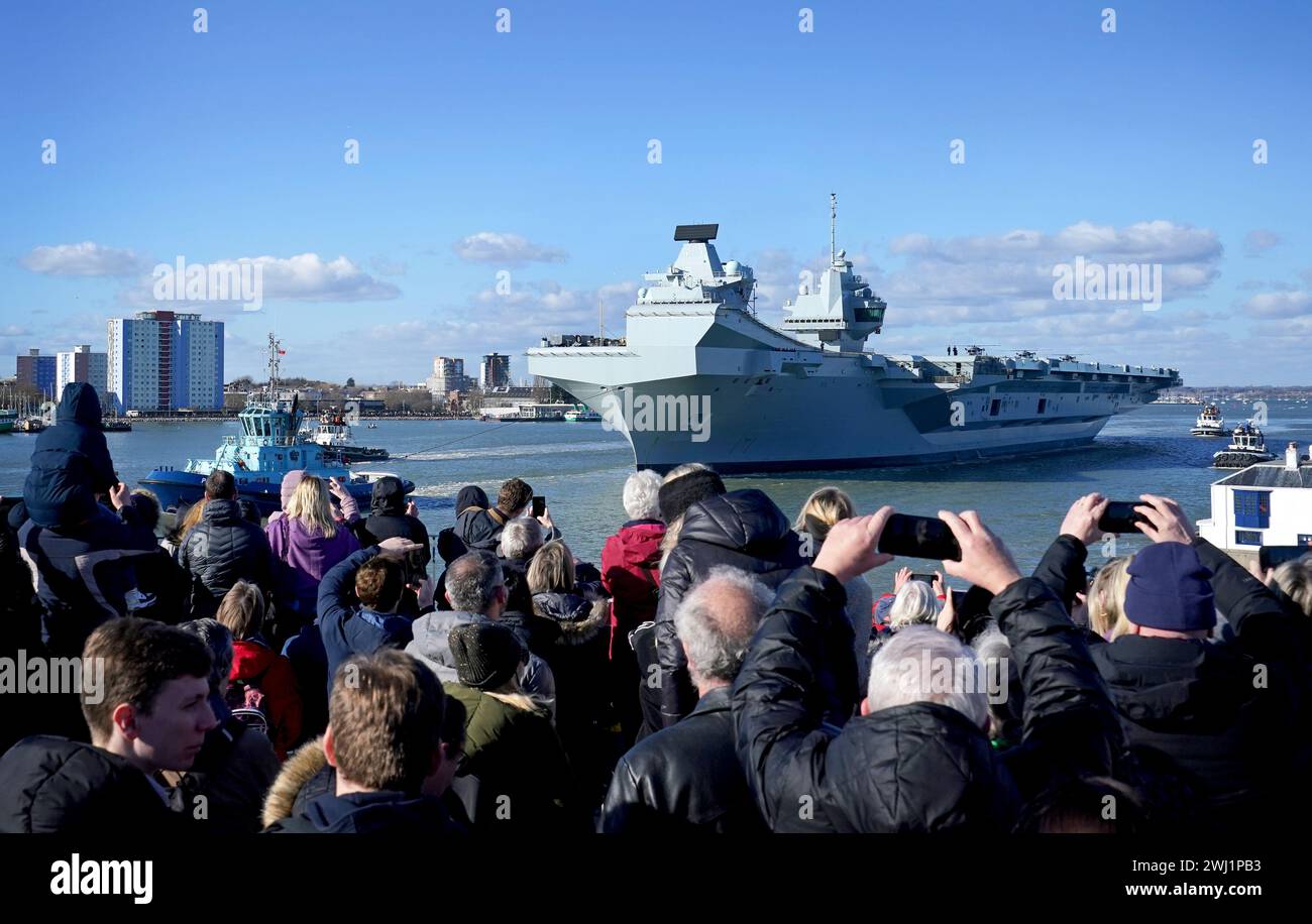 Royal Navy aircraft carrier HMS Prince of Wales sets sail from Portsmouth Harbour to lead the largest Nato exercise since the Cold War, involving more than 40 vessels, after its sister ship was forced to cancel its deployment because of an 'issue' with its propeller shaft. Picture date: Monday February 12, 2024. Stock Photo