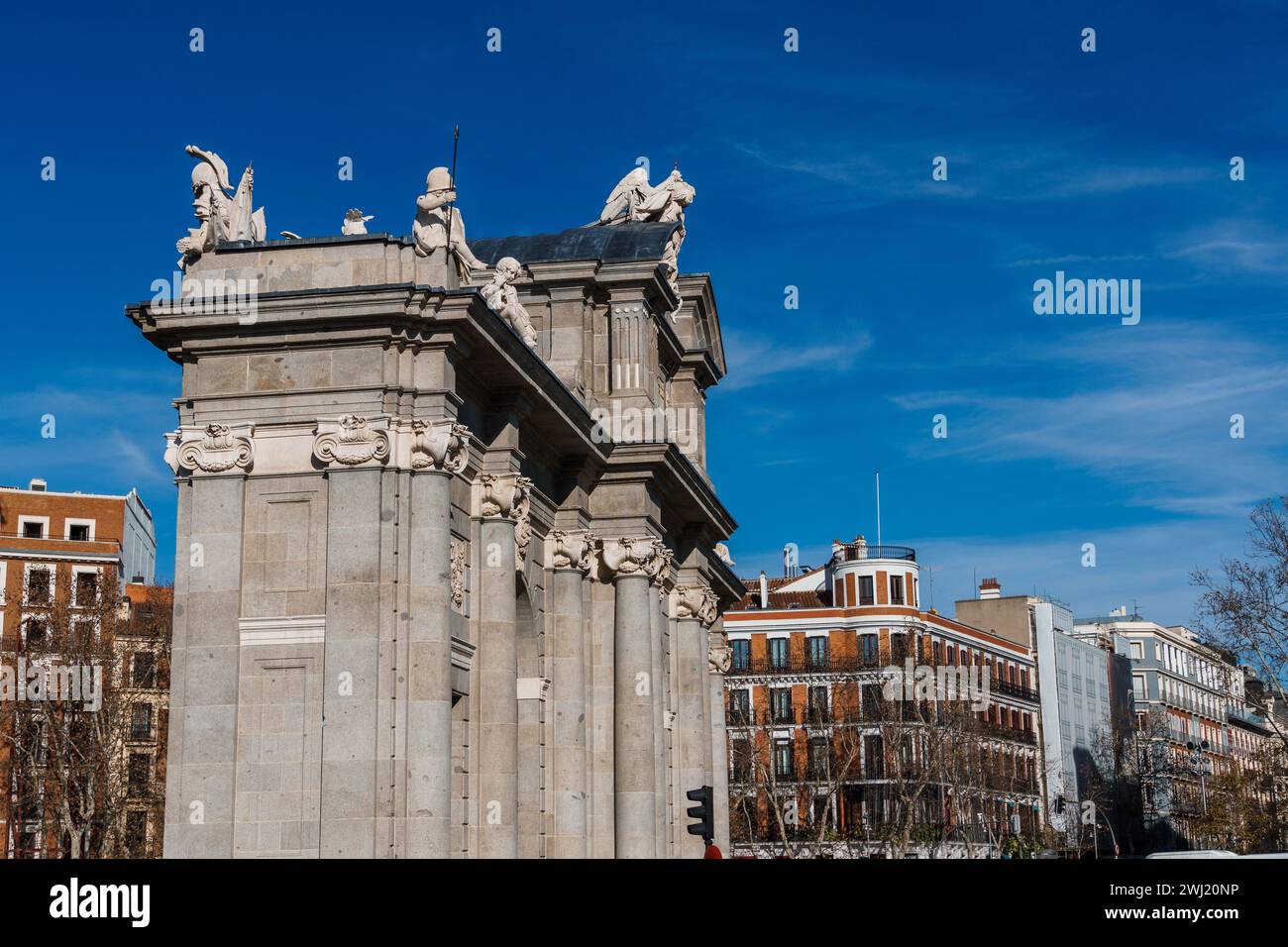 Puerta de Alcala is a Neo-classical gate in the Plaza de la Independencia in Madrid, Spain. Stock Photo