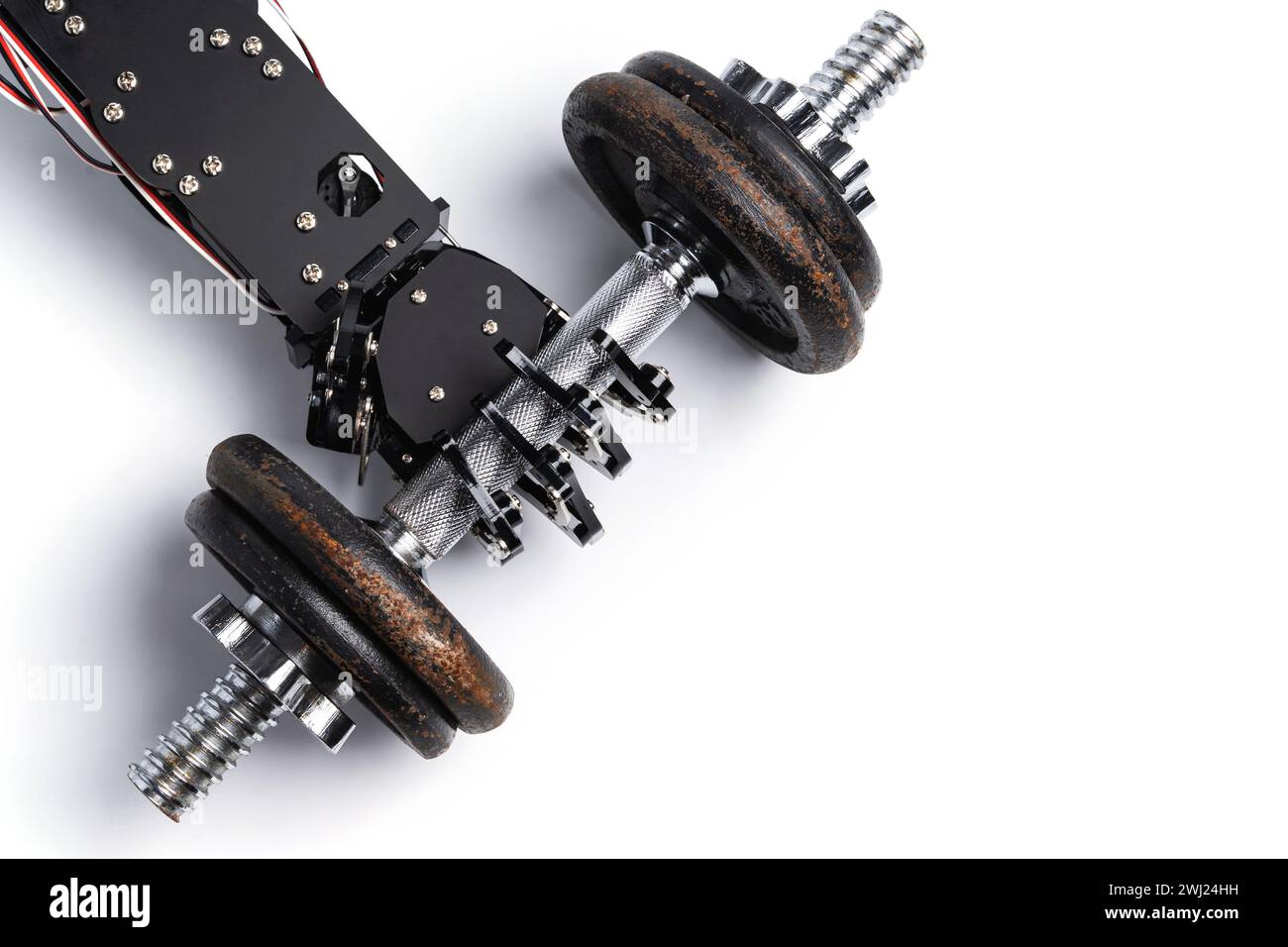 Real robotic hand with dumbbell. Strength of Artificial intelligence Stock Photo