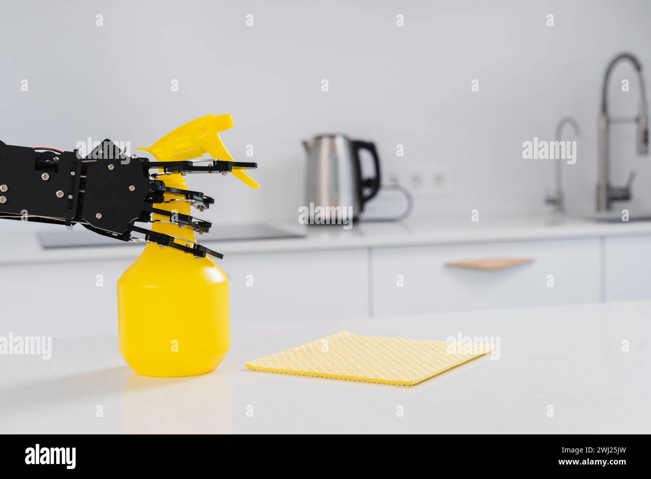 Real robot's hand with spray cleaner in white kitchen. Concept of ...