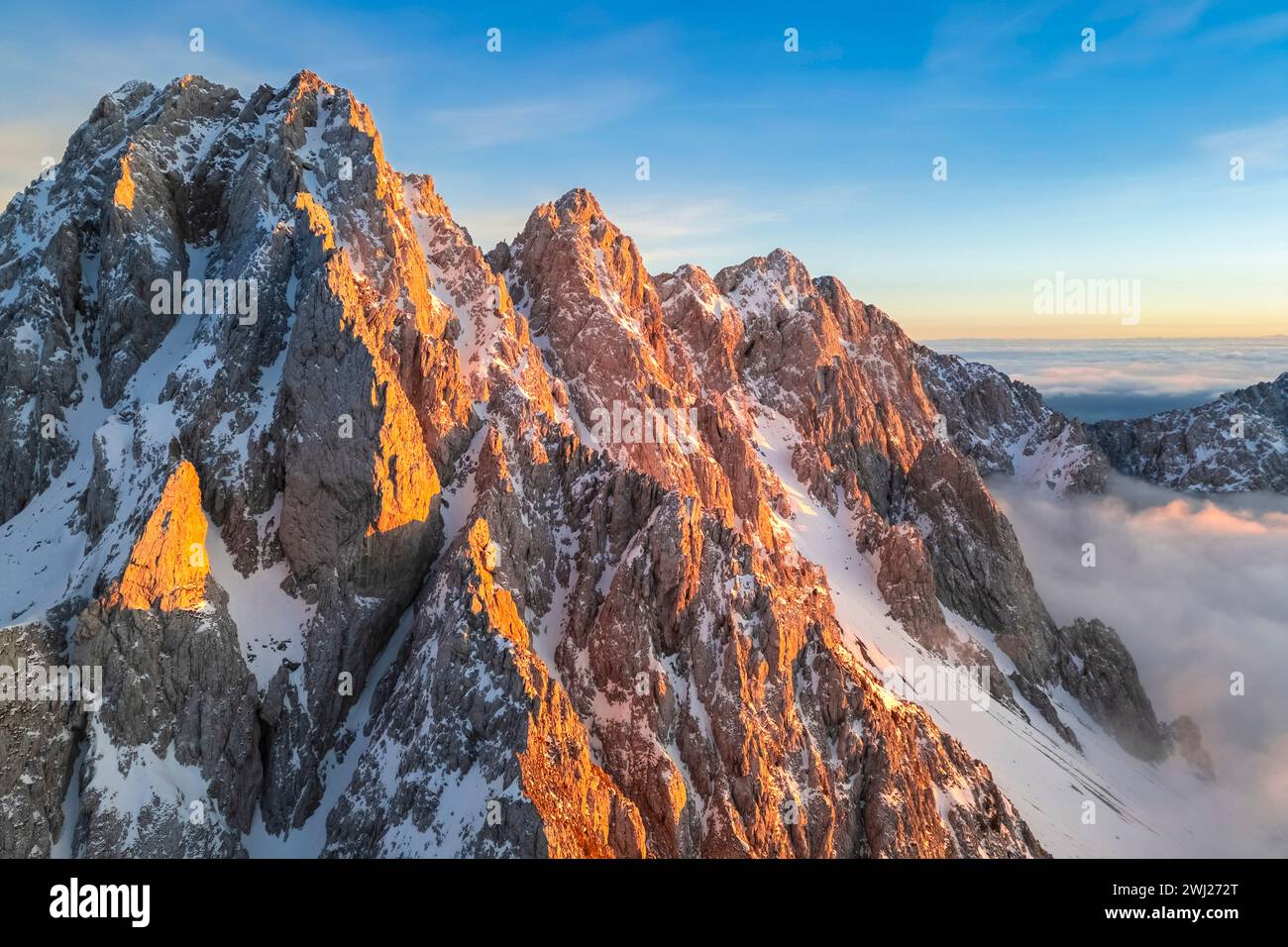 Aerial view of the Pizzo Camino mount at sunset in winter. Schilpario, Val di Scalve, bergamo district, Lombardy, Italy. Stock Photo