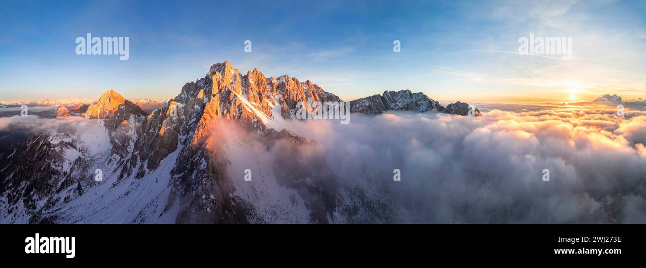 Aerial view of the Pizzo Camino mount at sunset in winter. Schilpario, Val di Scalve, bergamo district, Lombardy, Italy. Stock Photo