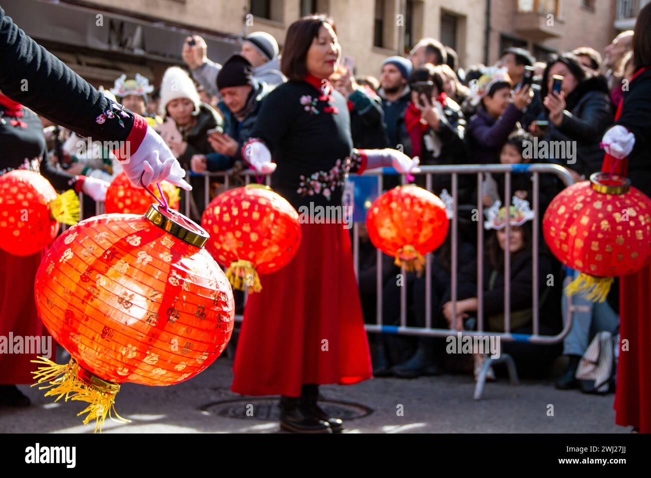 Chinese New Year Wooden Dragon Parade. In this case we can see the dance with red balloons carried by Chinese women Stock Photo