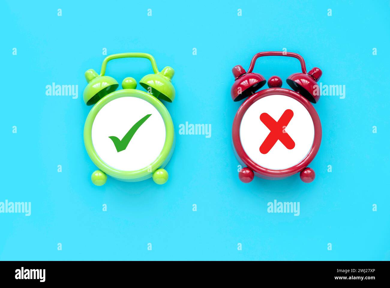 Concept of evaluation. True or false symbol. Accepted or rejected. Yes or no icon over a an alarm clock. Stock Photo