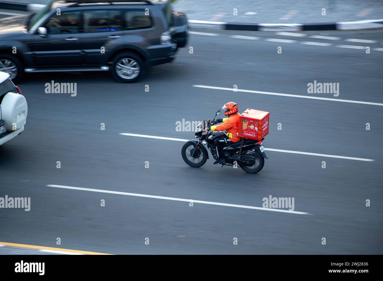 Delivery boy Talabat food Delivery rider on road Stock Photo