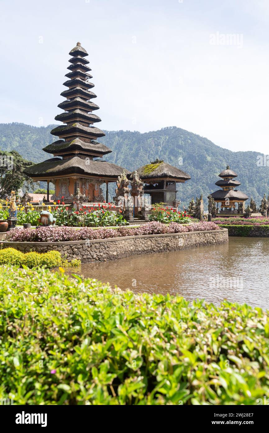 Iconic balinese Beratan temple next to lake during sunny day Stock Photo