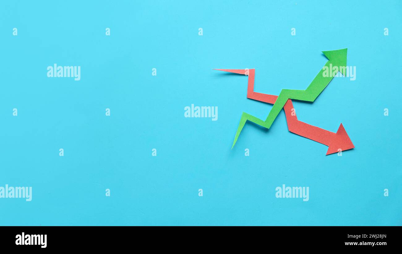 red and green arrow graph over a blue background. Copy space Stock ...