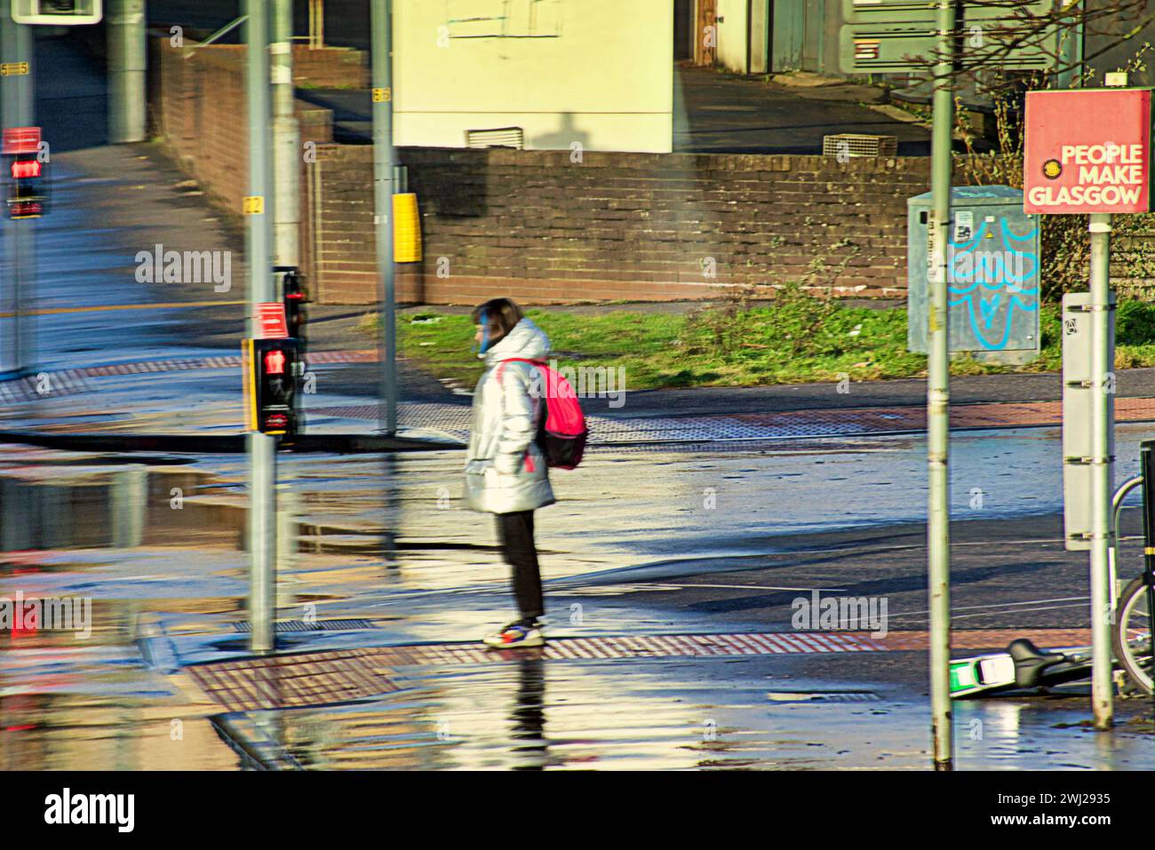 Glasgow, Scotland, UK. 12th February, 2024. UK Weather:  Cold start saw locals on the streets in the centre of the city. Potholes, traffic and crossings continue to plague the city.  Credit Gerard Ferry/Alamy Live News Stock Photo