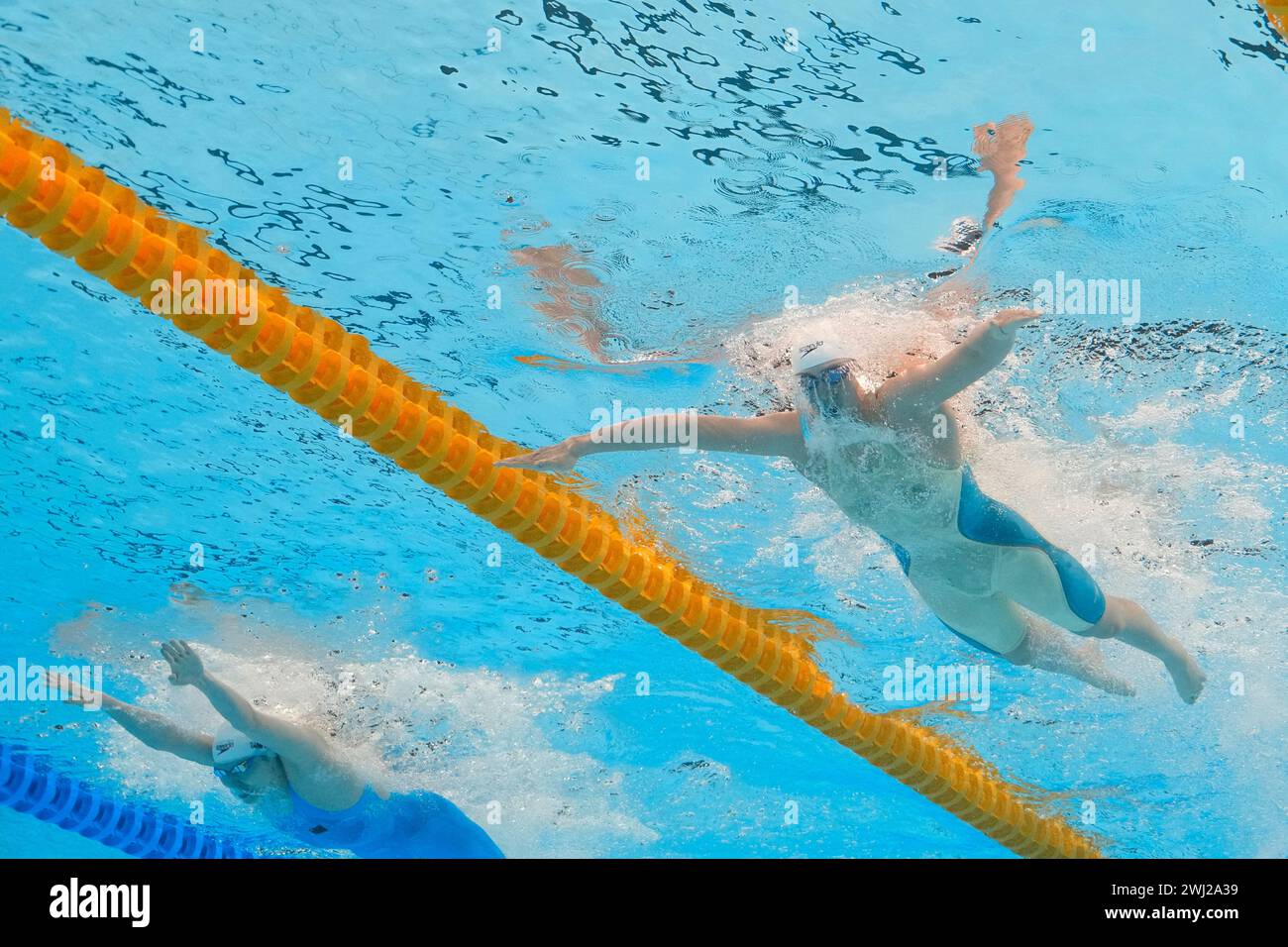 Yang Chang of China, left, and Tang Qianting of China compete in the women