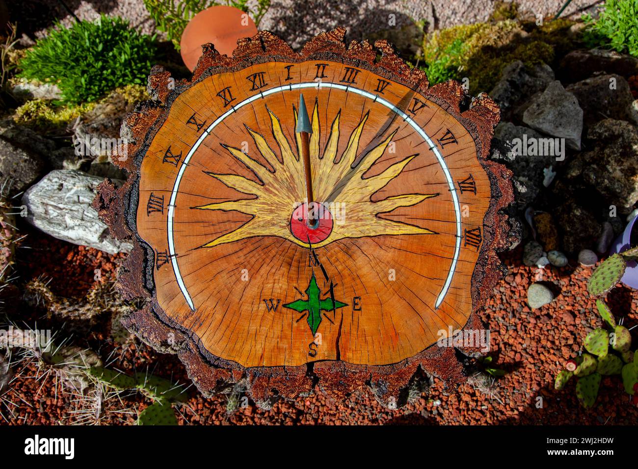 DIY Sundial made in the wood. Painted garden sundial. astronomical sun clock dial. cross section Stock Photo