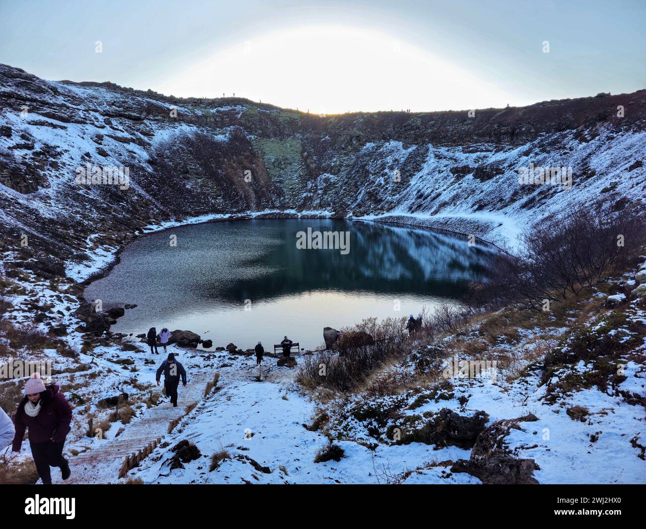 A winter scene showcasing a snow-covered lake in Iceland Stock Photo