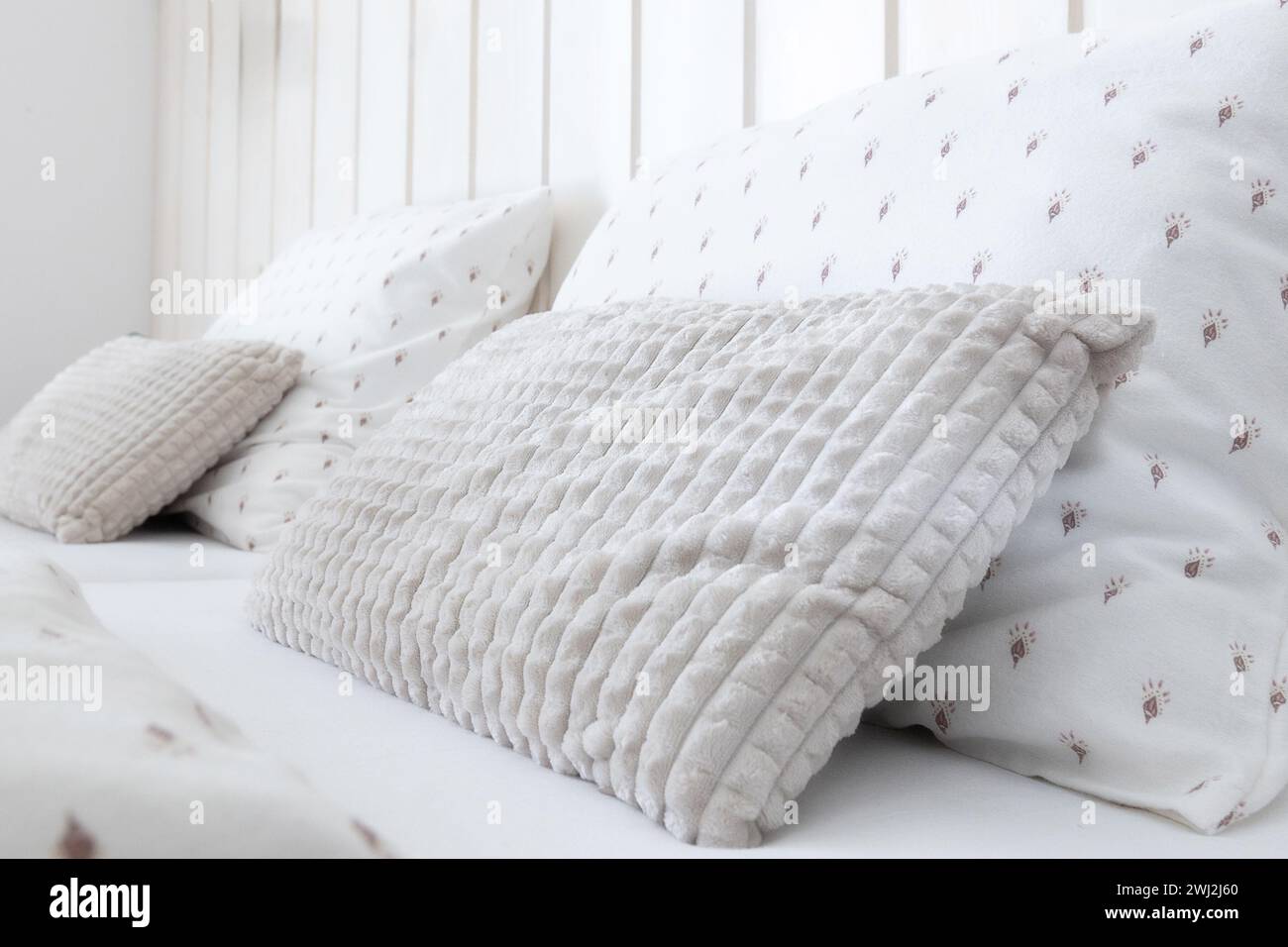 White comfortable soft pillows on the bed Stock Photo