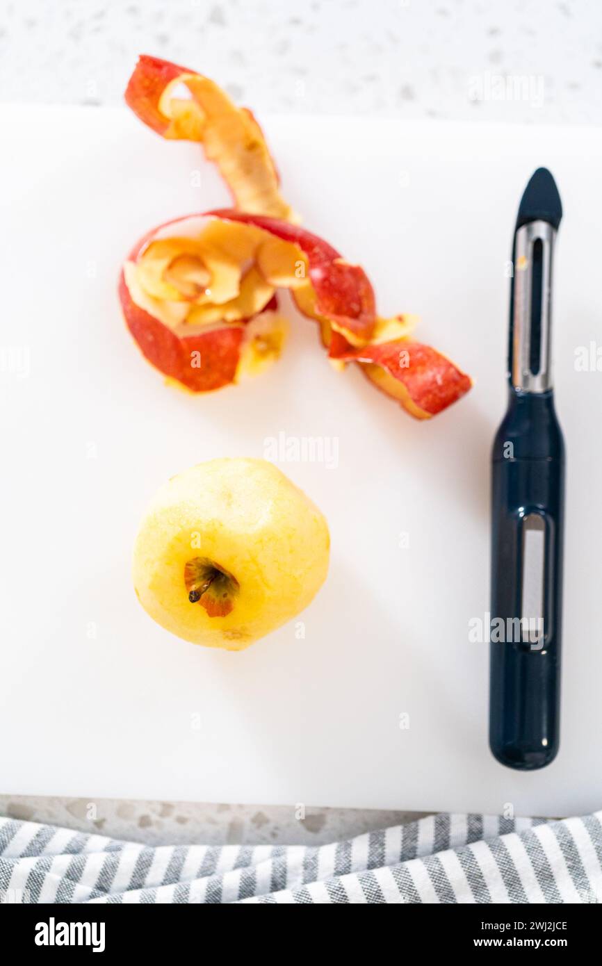 Peeling red apples Stock Photo