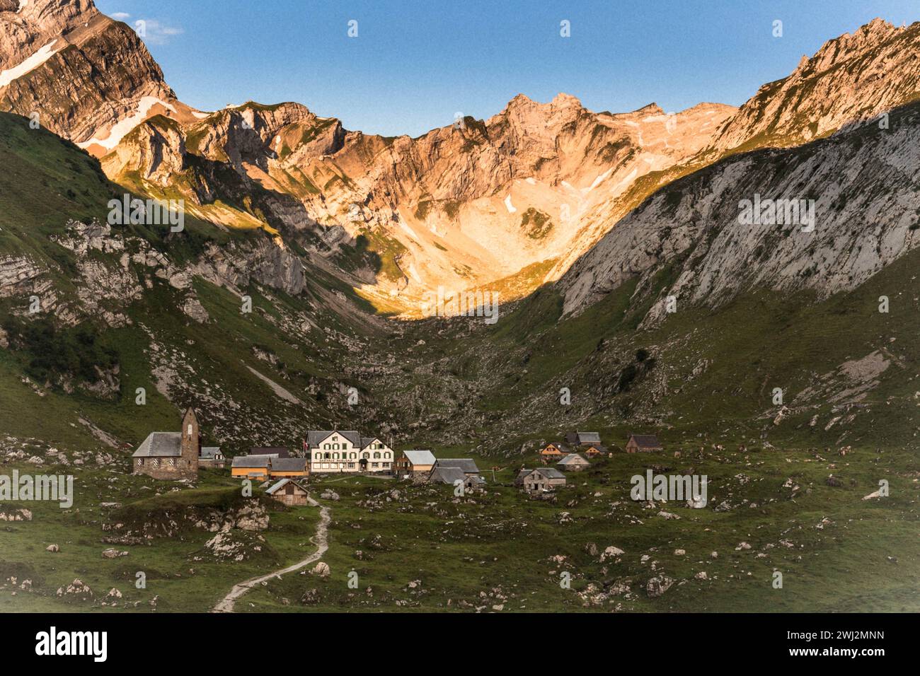 On a hike along the boarder between Austria and Switzerland you walk by stunning landscapes, mountain sceneries and mountain villages that look like they have been asleep for the last 100 years. Stock Photo