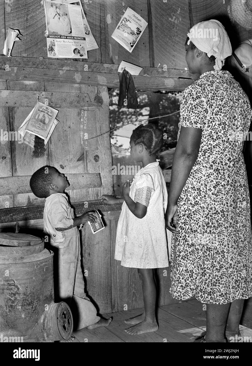 Woman teaching three children Black and White Stock Photos & Images - Alamy