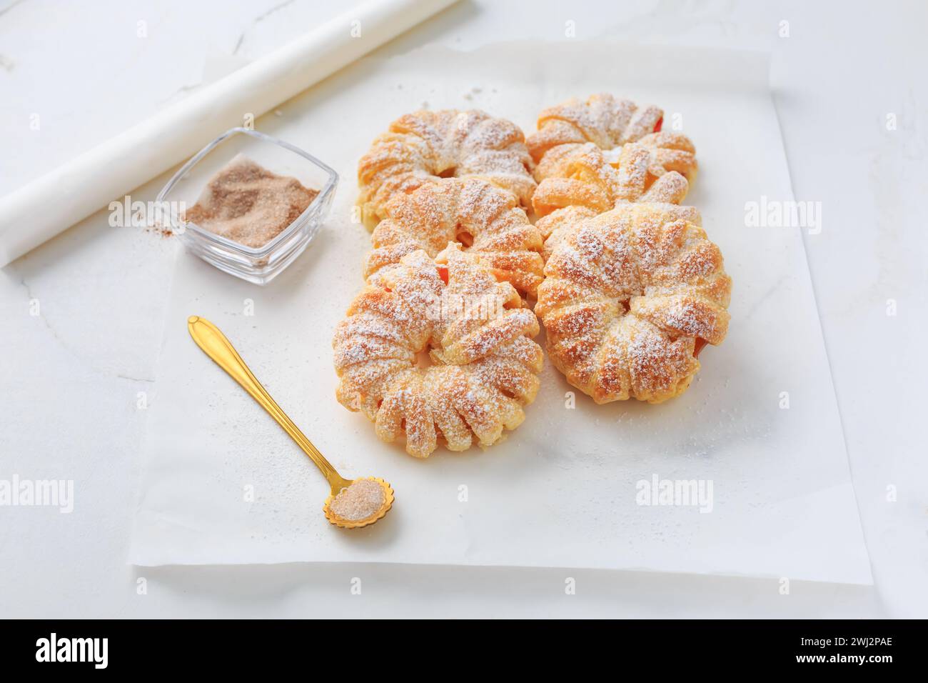 Homemade puff pastry apple rings, small healthy snack Stock Photo