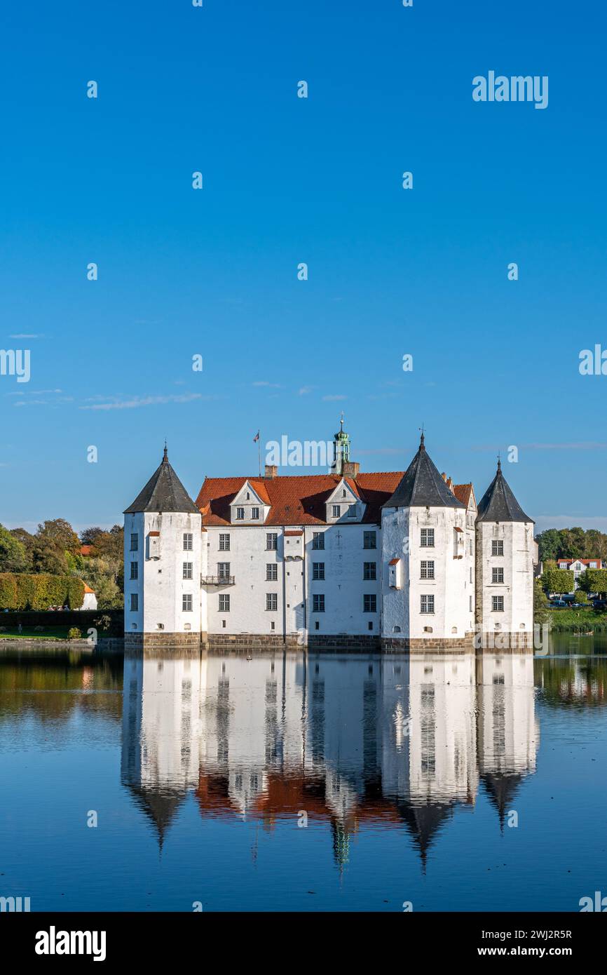 The beautiful Glücksburg Castle relfecting in the water. Stock Photo