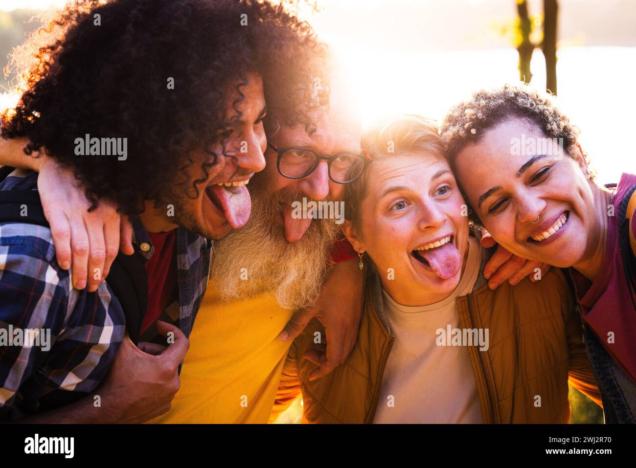 Playful Bonding: Friends Sharing Joyful Moments Stock Photo