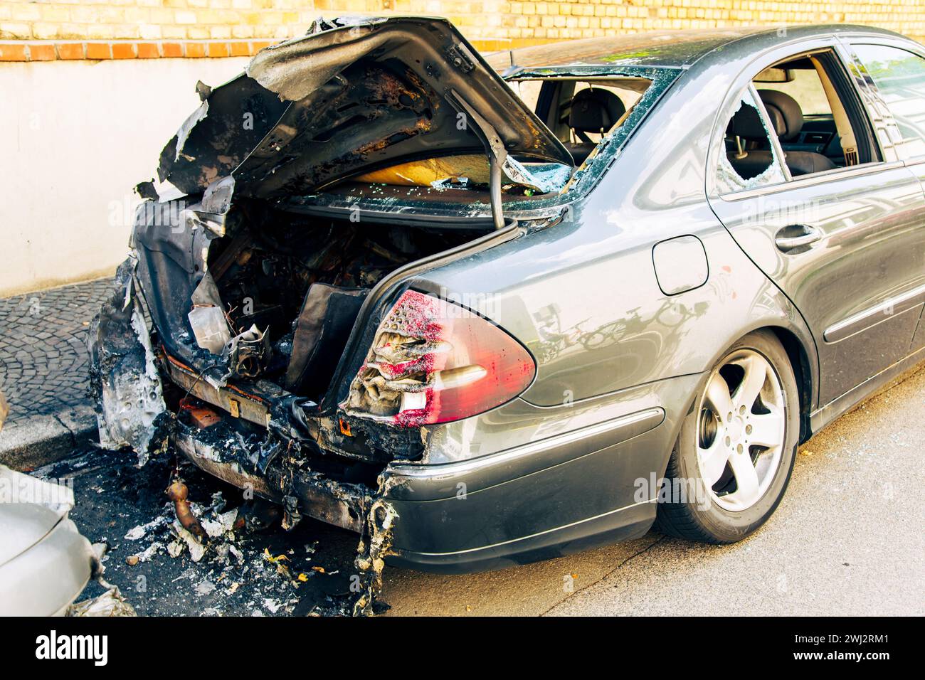 Arson in the residential district after extinguishing it. Accident on the road. car fire, burned Stock Photo