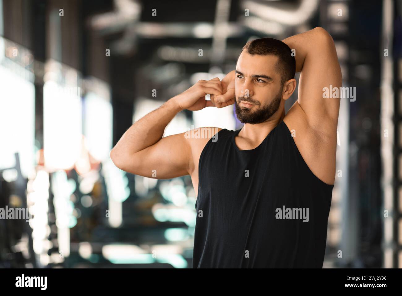 Bearded man stretching arm muscles hi-res stock photography and images ...
