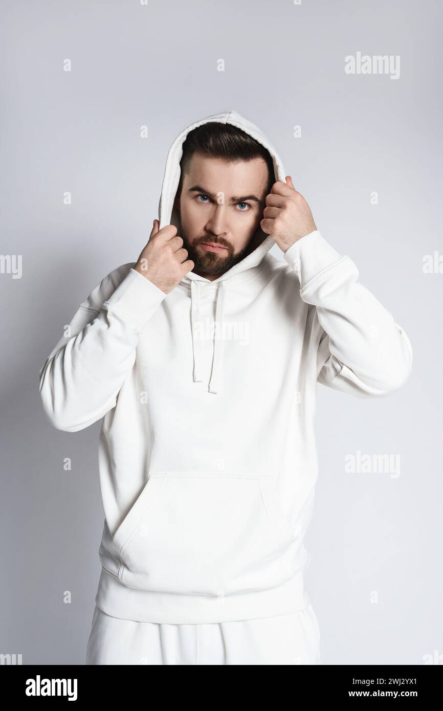 Handsome man wearing blank white hoodie and pants Stock Photo