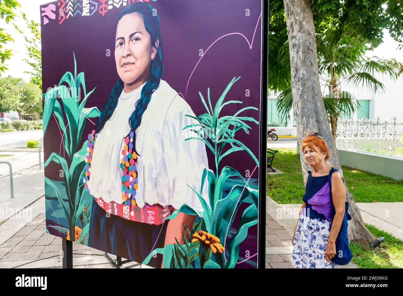 Merida Mexico,Merida Mexico,Zona Paseo Montejo Centro,sidewalk exhibit woman women lady female,adult adults,resident residents,artists,sign billboard Stock Photo