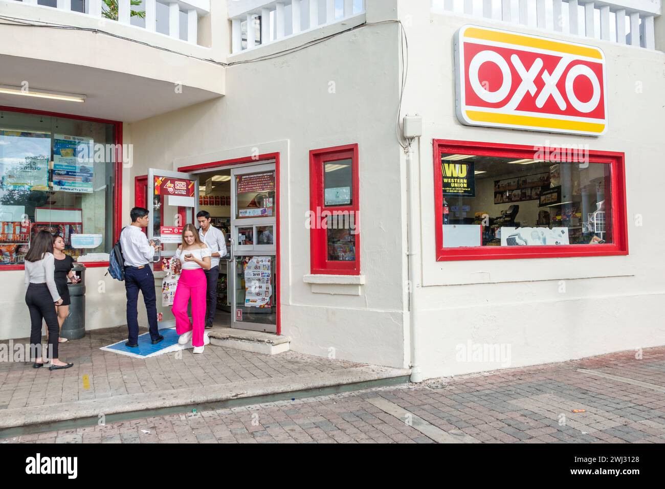 Merida Mexico,Merida Mexico,Zona Paseo Montejo Centro,Oxxo convenience store,outside exterior front entrance,man men male,convenience food store busin Stock Photo