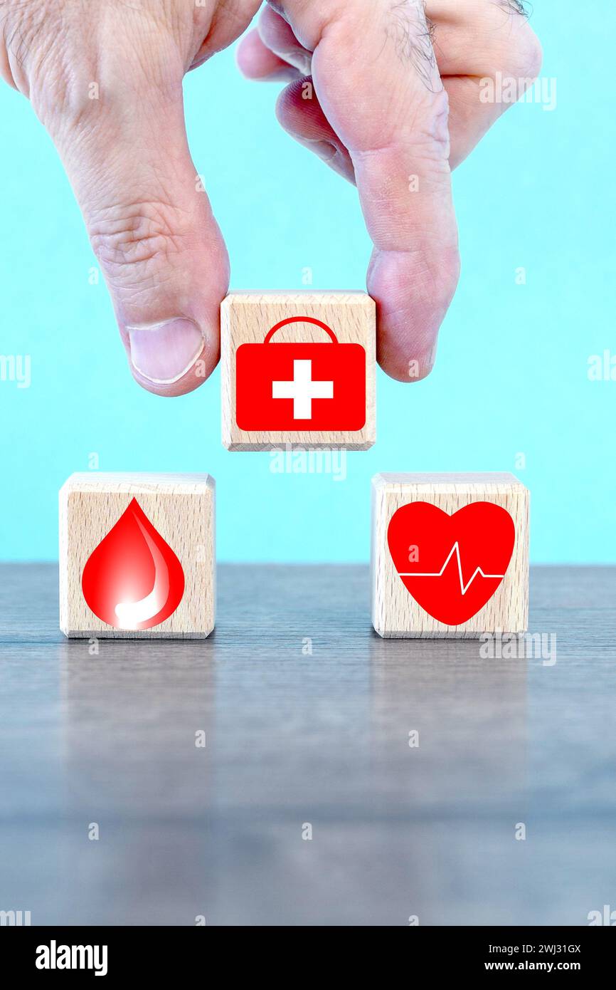 hand holding wood cube with healthcare medical icons. Health insurance ...