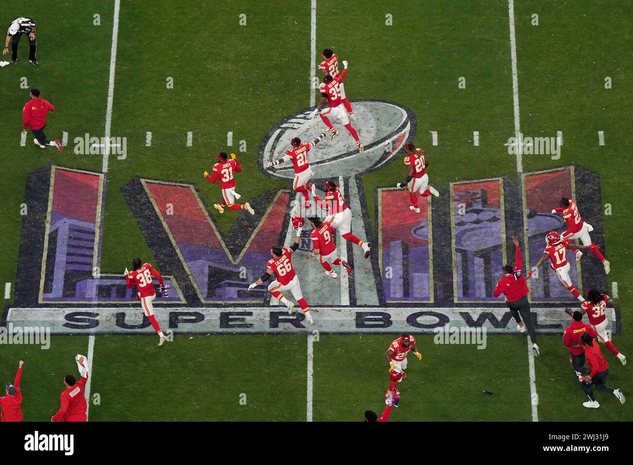 The Kansas City Chiefs rush the field after their victory over the San Francisco 49ers during