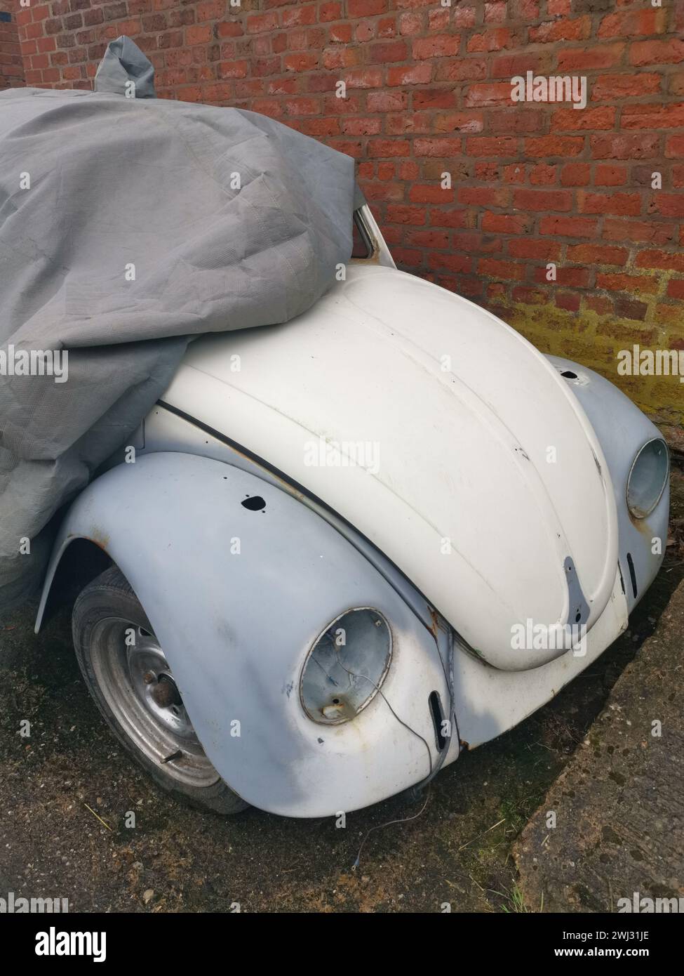 A vintage Volkswagen Beetle in the process of restoration. Stock Photo