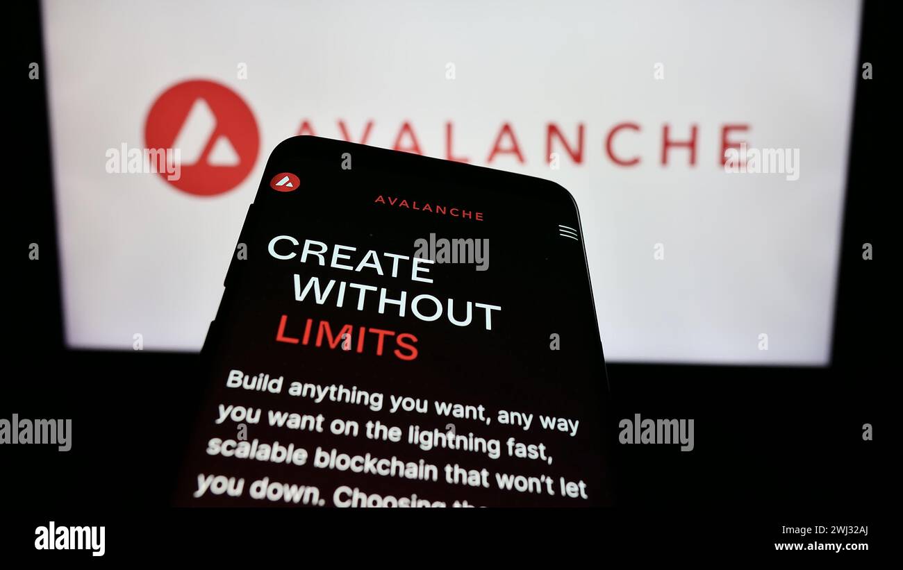Mobile phone with website of blockchain company Avalanche (BVI) Inc. (Avax  Network) in front of business logo. Focus on top-left of phone display  Stock Photo - Alamy