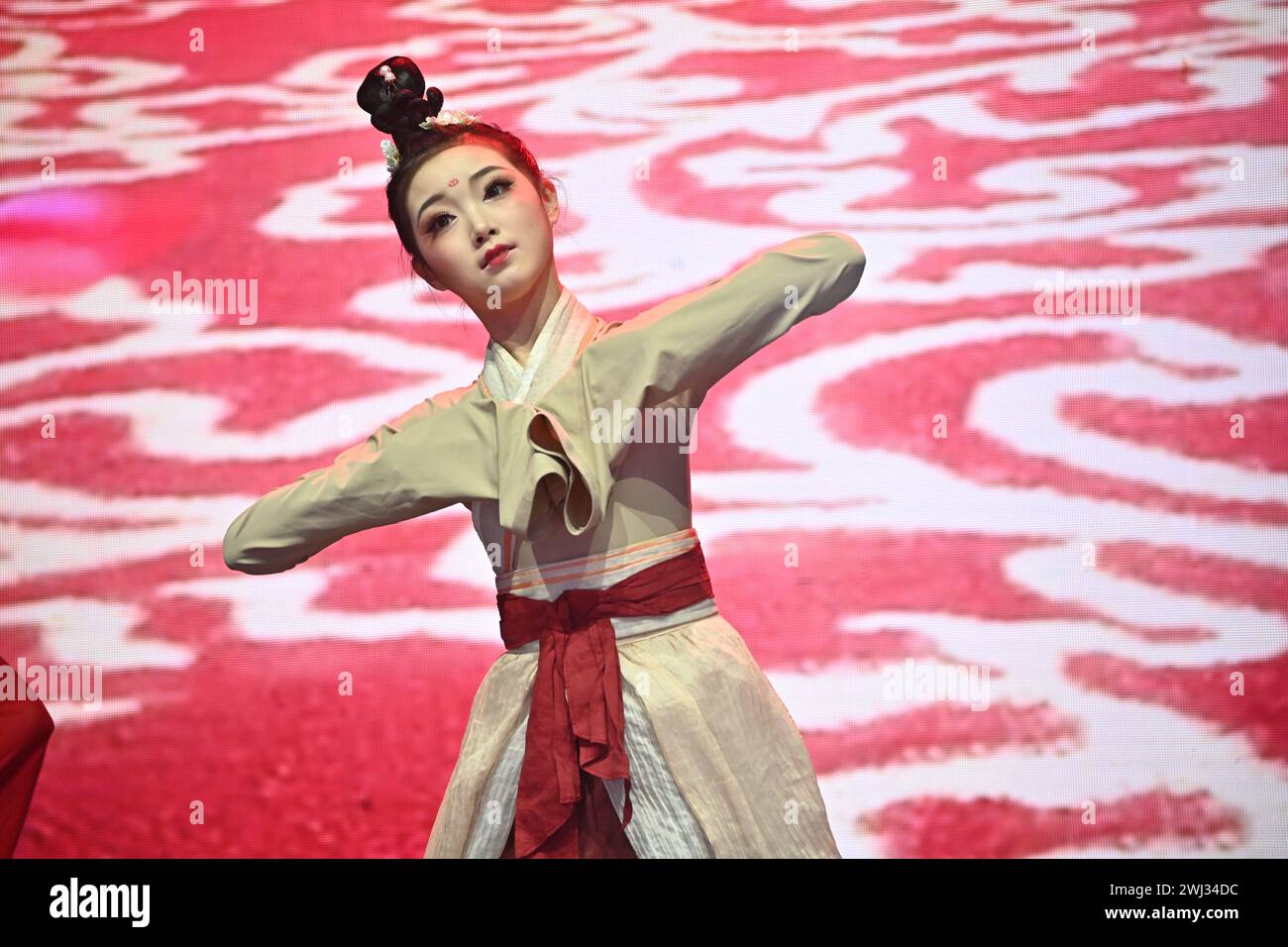 Trafalgar square, London, UK, 11 February 2024: Chinese sleeve dance preforms at the 2024 Lunar New Year a spectacular show this year for the 2024 Lunar New Year, with the CPC sponsoring the entire performances that comes from Beijing and Guangzhou. The Lunar New Year is also known as Chinese New Year or Spring Festival. The Chinese celebration in London attracted thousands of people. Experience traditional dragon and flying lion dances and fun-filled stage performances from China, including Beijing opera and acrobatics, martial arts displays, and ancient magic in London, UK. Stock Photo