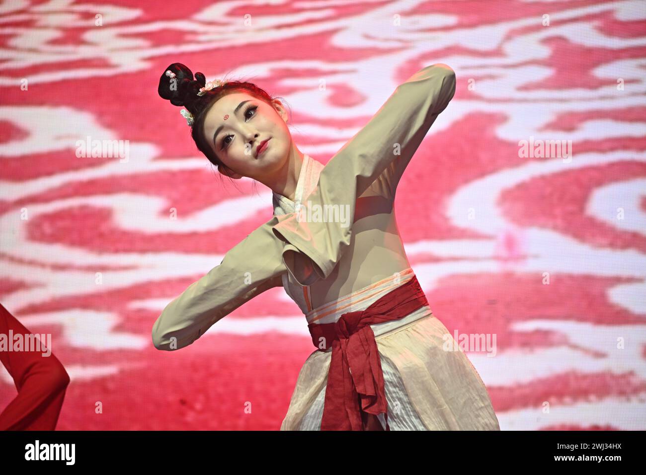 Trafalgar square, London, UK, 11 February 2024: Chinese sleeve dance preforms at the 2024 Lunar New Year a spectacular show this year for the 2024 Lunar New Year, with the CPC sponsoring the entire performances that comes from Beijing and Guangzhou. The Lunar New Year is also known as Chinese New Year or Spring Festival. The Chinese celebration in London attracted thousands of people. Experience traditional dragon and flying lion dances and fun-filled stage performances from China, including Beijing opera and acrobatics, martial arts displays, and ancient magic in London, UK. Stock Photo