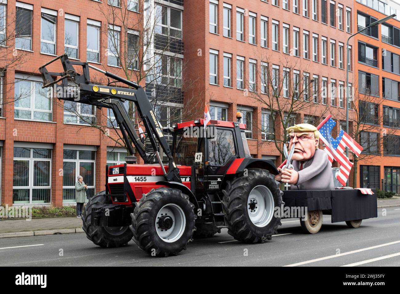 Rose Monday carnival parade in Düsseldorf. Float designed by Jacques Tilly. Depicting former US-president Donald Trump holding a swastika made of the stars and stripes. Stock Photo