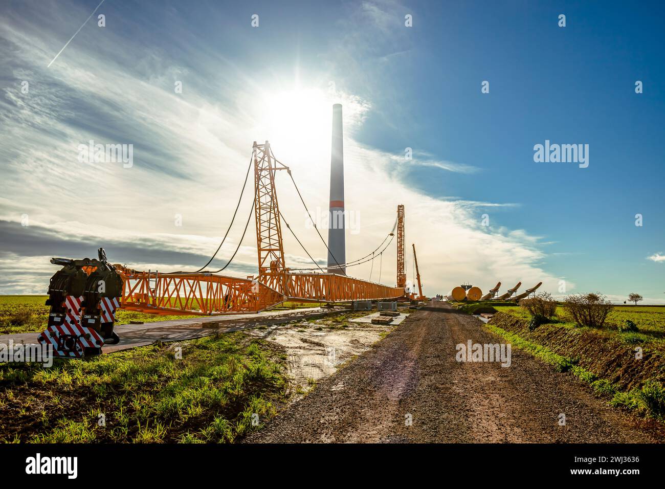 Wind turbines under construction. Crawler Track Crane - machinery. Building and assembling a constru Stock Photo