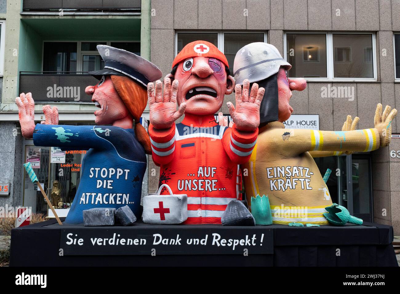 Rose Monday carnival parade in Düsseldorf. Float designed by Jacques Tilly thanking emergency service workers. Stock Photo