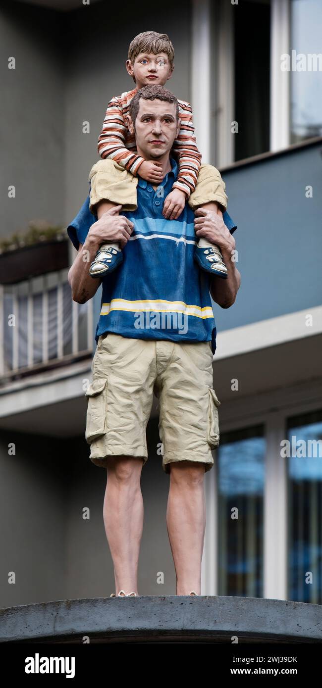 Realistic sculpture of Holy Father and Son on a lift barrel column, Duesseldorf, Germany, Europe Stock Photo