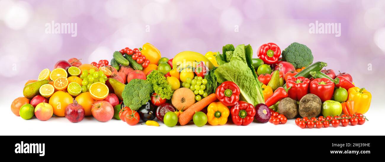 Panoramic wide photo healthy and useful vegetables and fruits on blurred background. Stock Photo