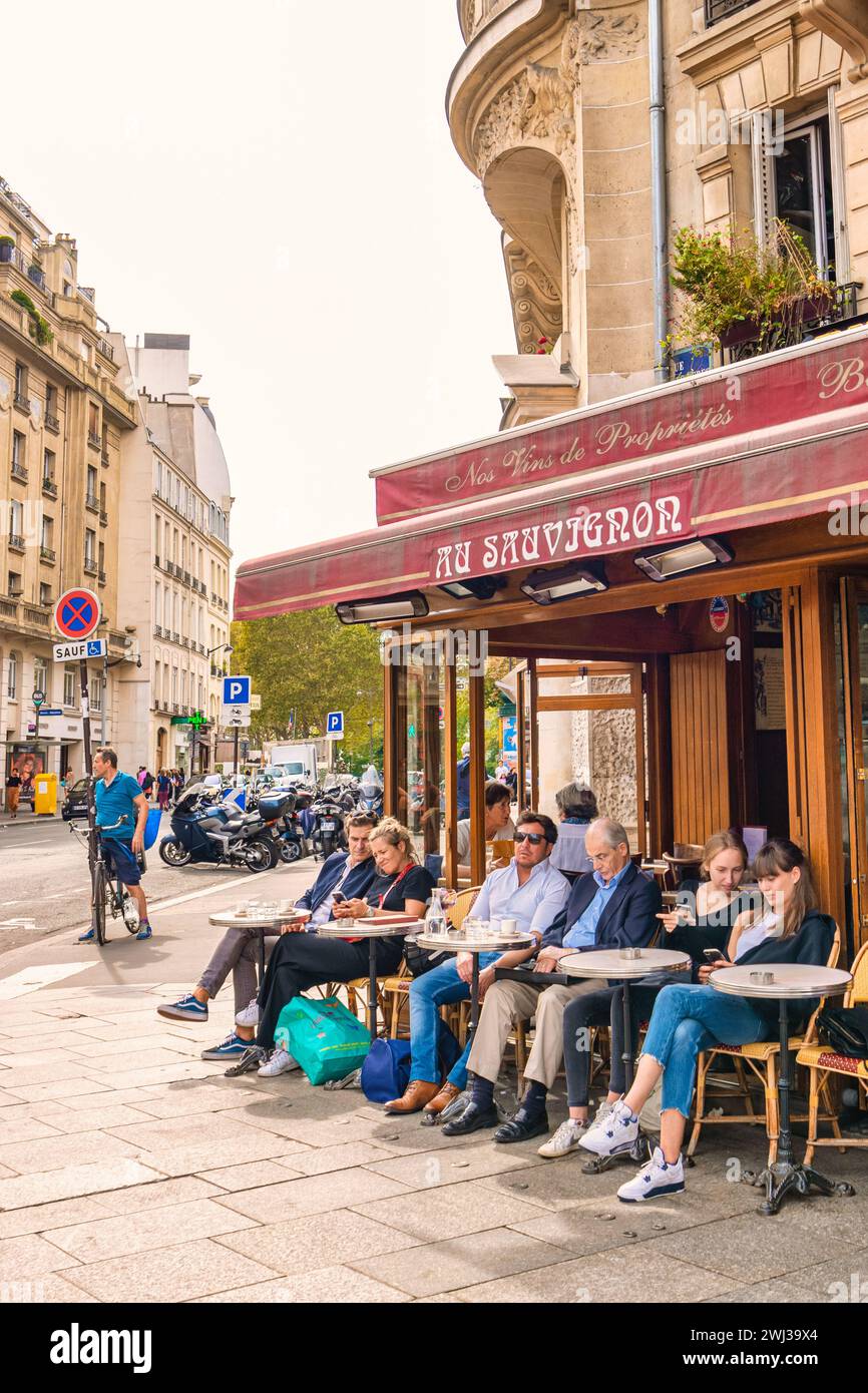 Paris France people drinking coffee on the terrace of a cafe restaurant during the Autumn Stock Photo