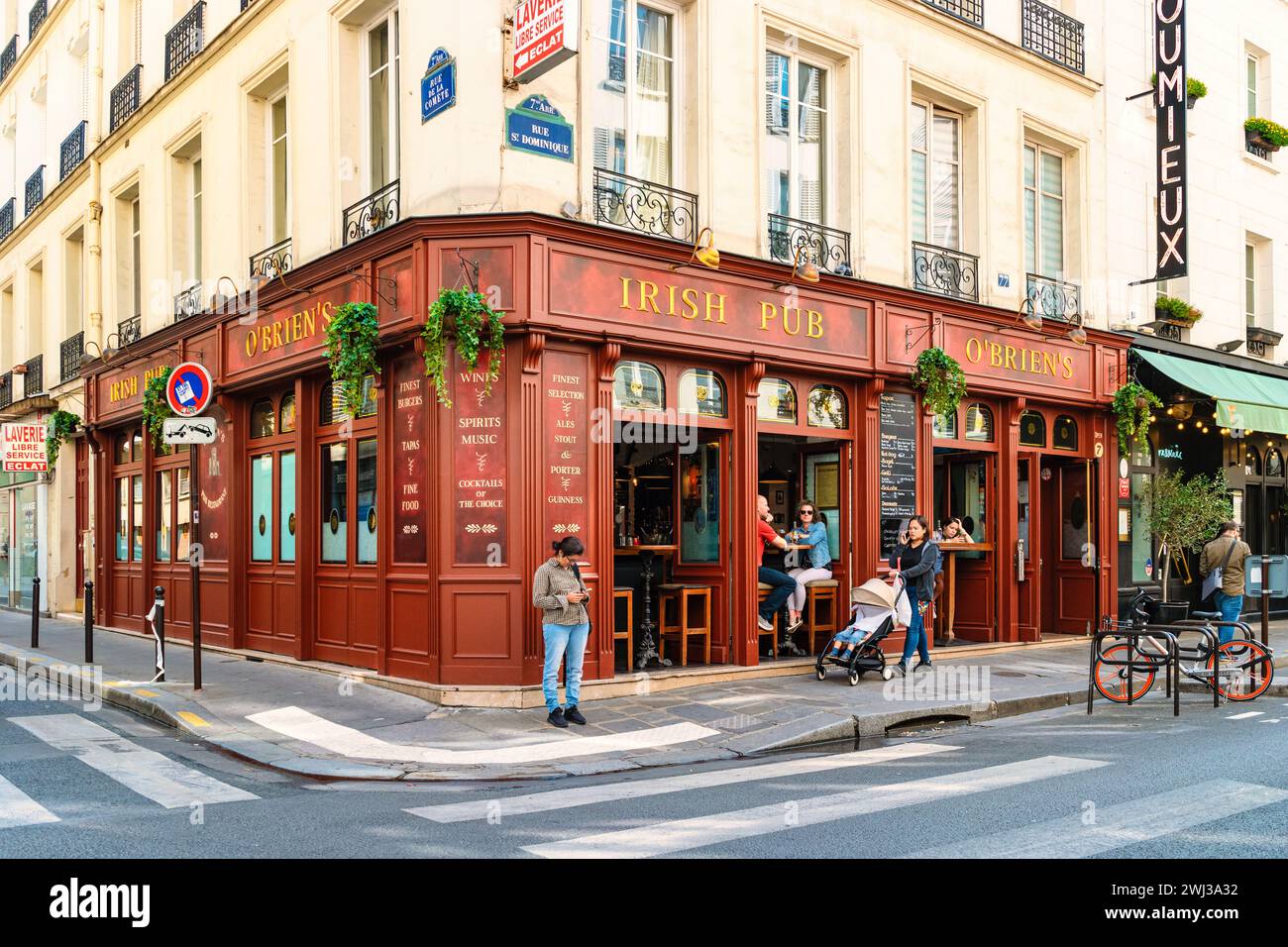 Paris France people drinking coffee on the terrace of a cafe restaurant during the Autumn Stock Photo