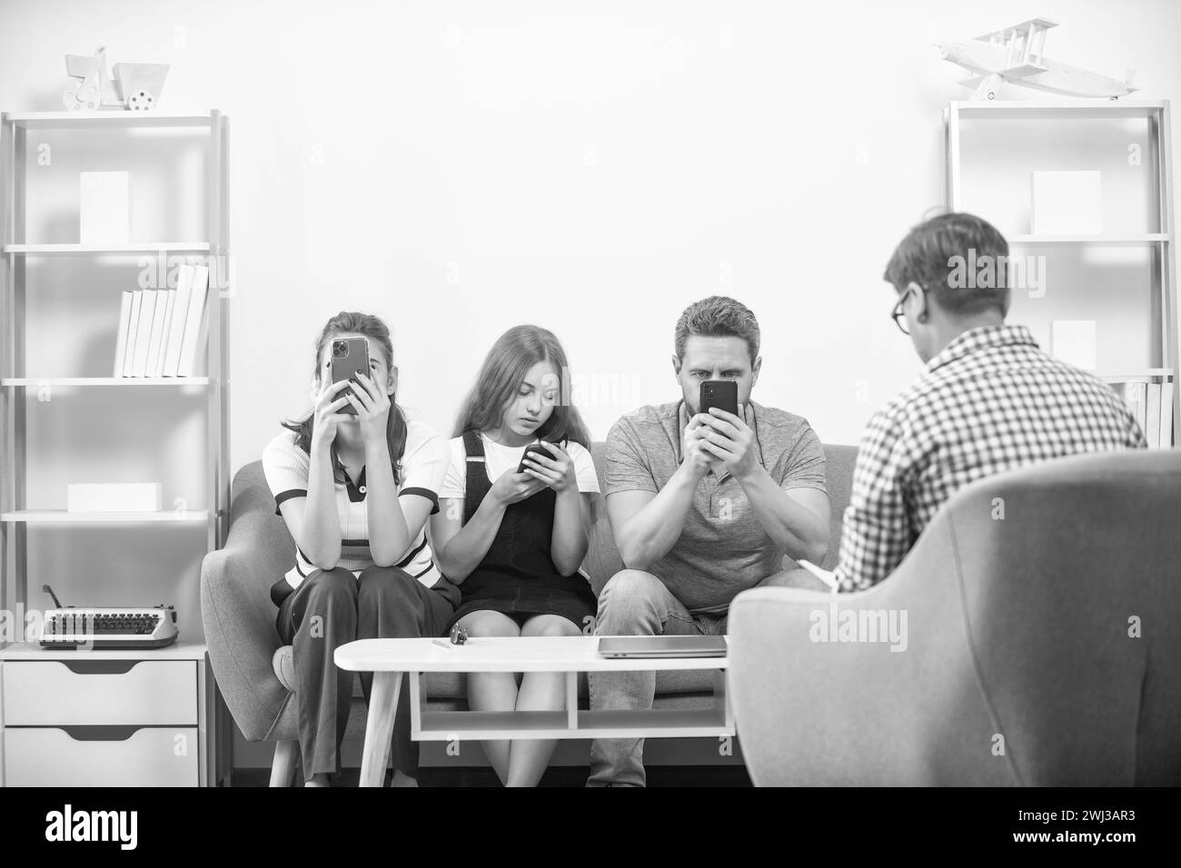 Picture of phone addicted father mother and child at family psychologist, internet ...