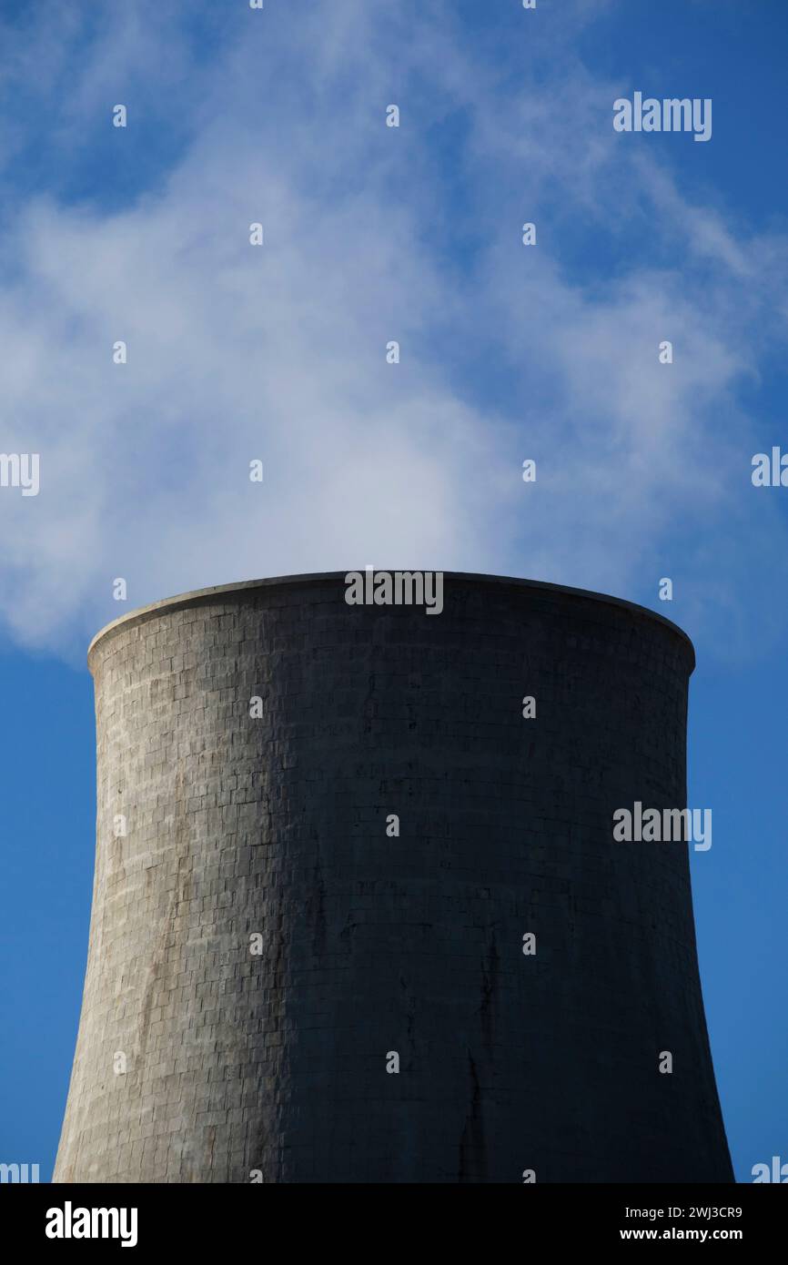 Photographic view of the steam cooling chimney coming from underground Stock Photo