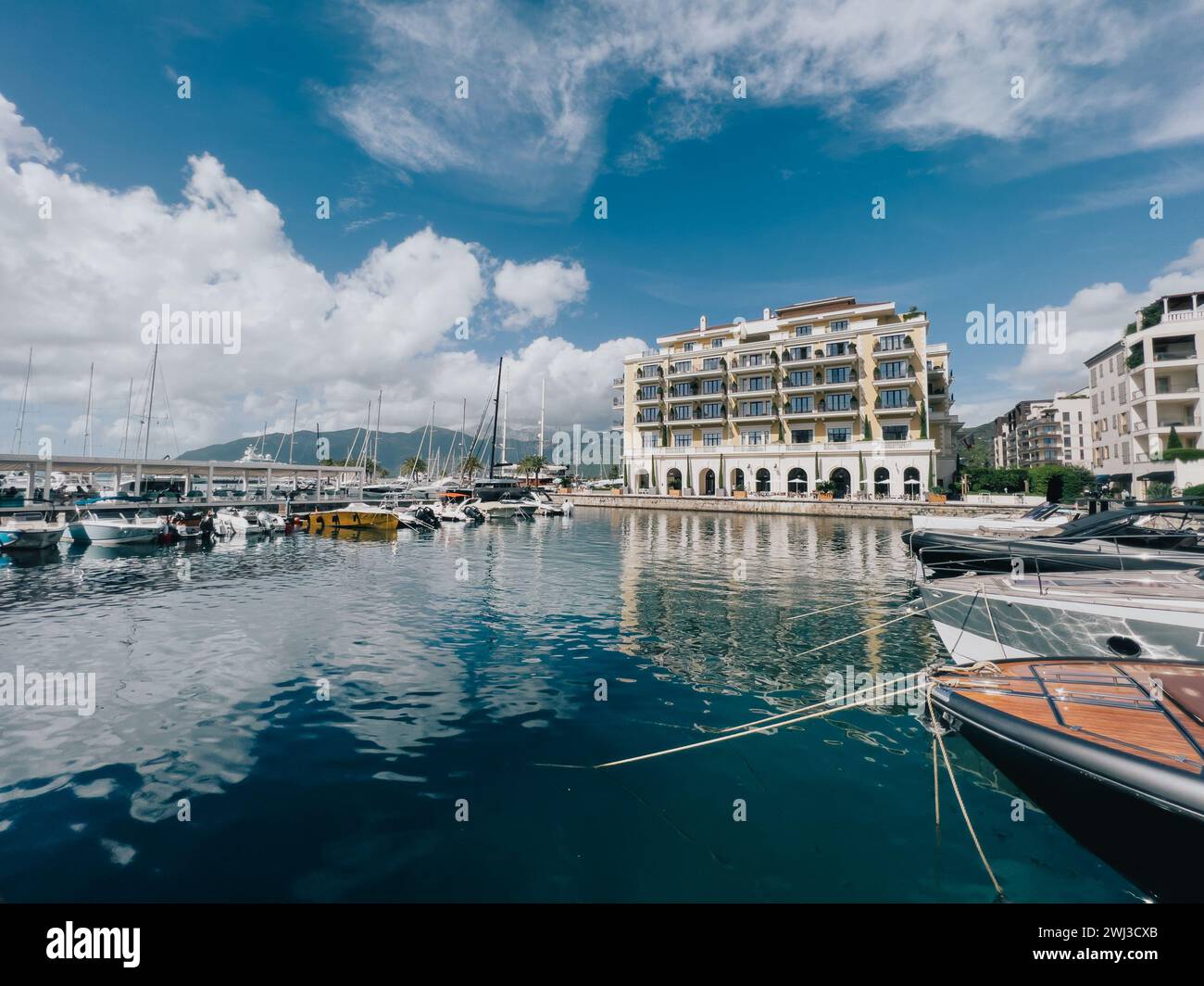 Tivat, Montenegro - 11 august 2023: Marina with moored yachts near the Regent Hotel. Porto, Montenegro Stock Photo