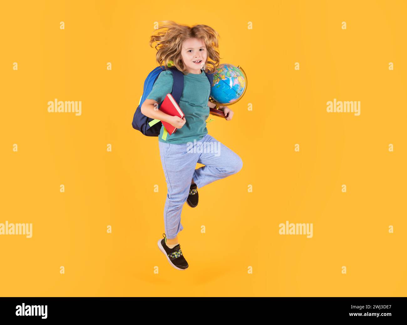 Back to school. School boy in school uniform with backpack jumping on ...