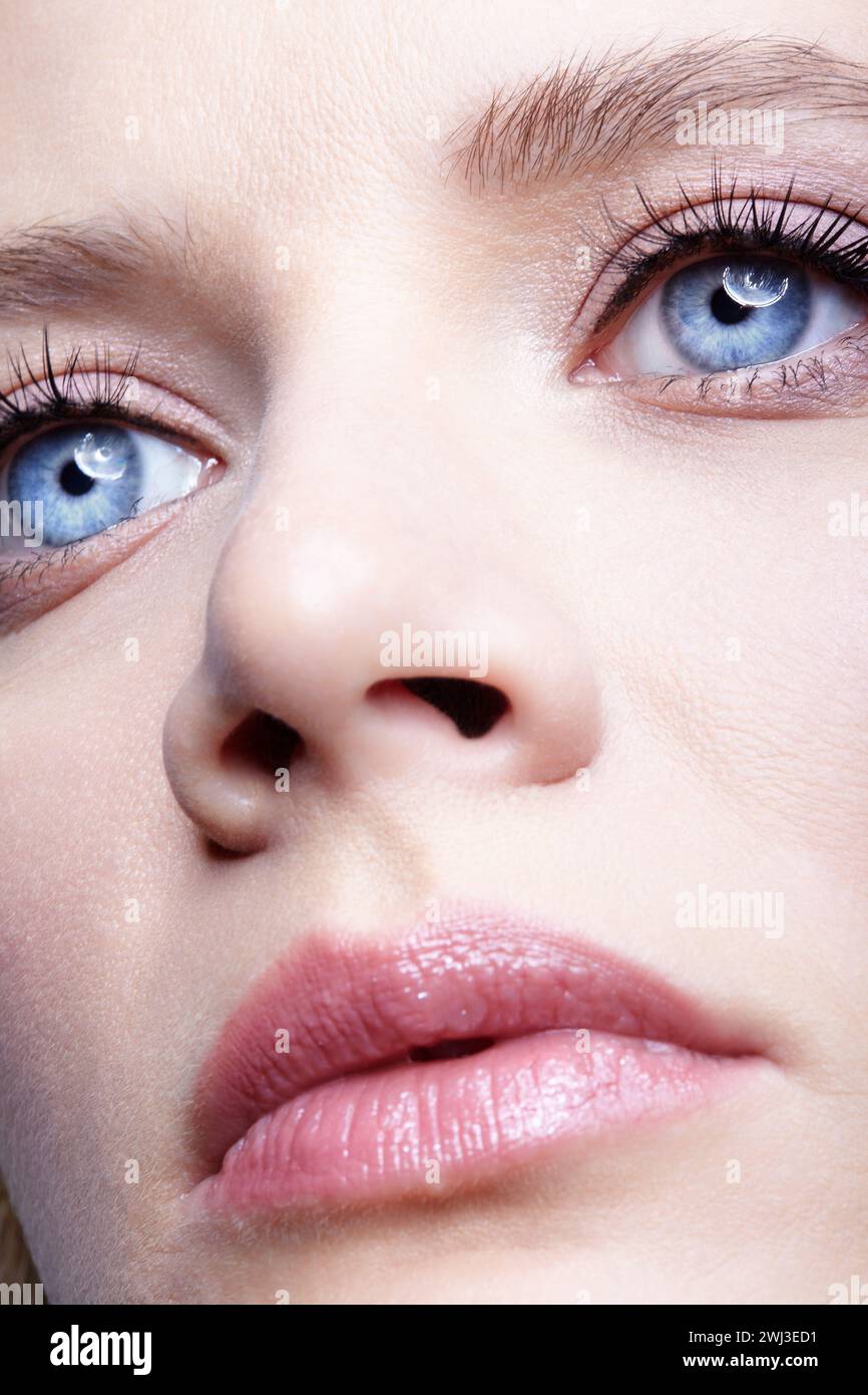 Closeup portrait of young female face. Woman with natural nude makeup Stock Photo