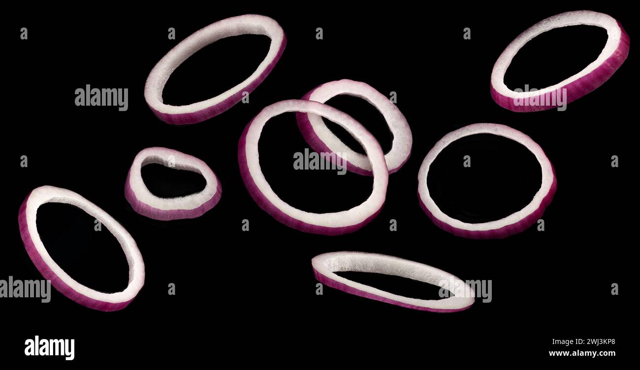 Red onion rings isolated on black background Stock Photo