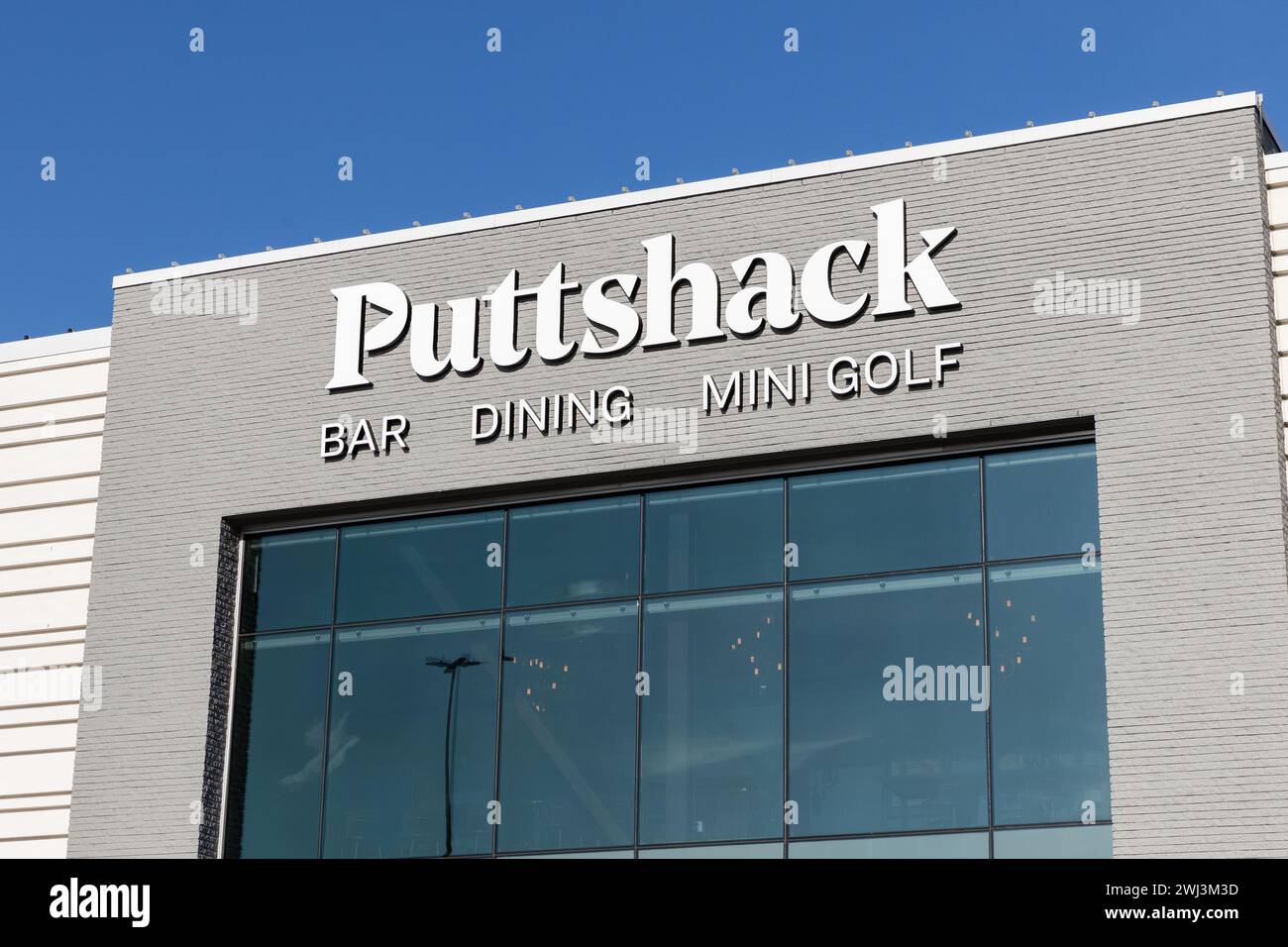 Puttshack is an an indoor miniature golf company that have gun games and food and drink. Stock Photo