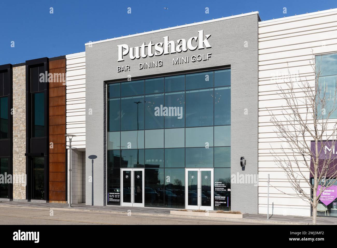 Puttshack is an an indoor miniature golf company that have gun games and food and drink. Stock Photo