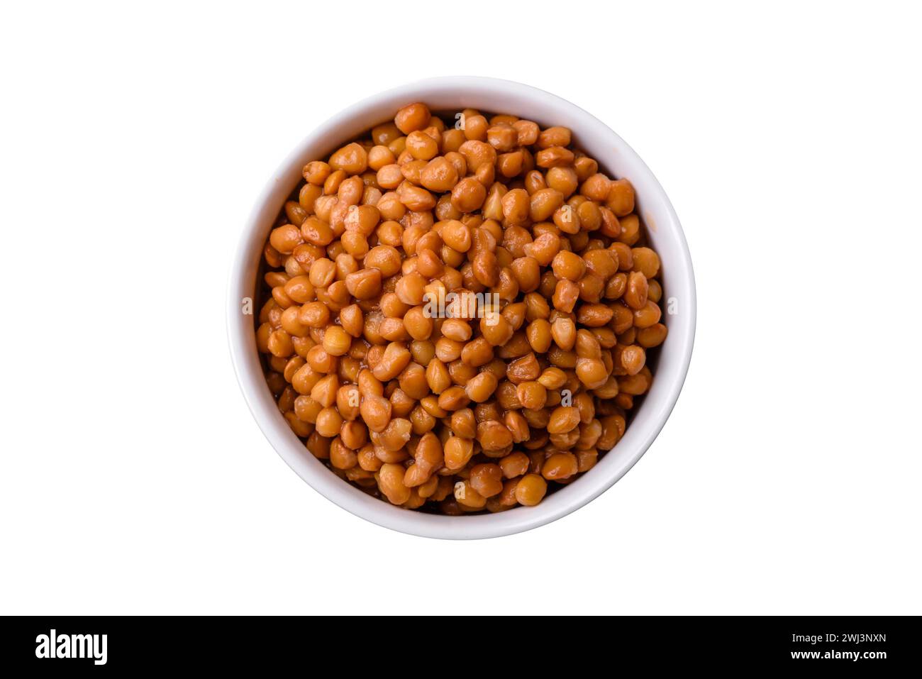 Delicious healthy canned lentils in a ceramic ribbed white bowl Stock Photo