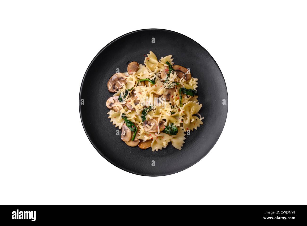 Delicious farfalle pasta with mushrooms, cheese and spinach with spices